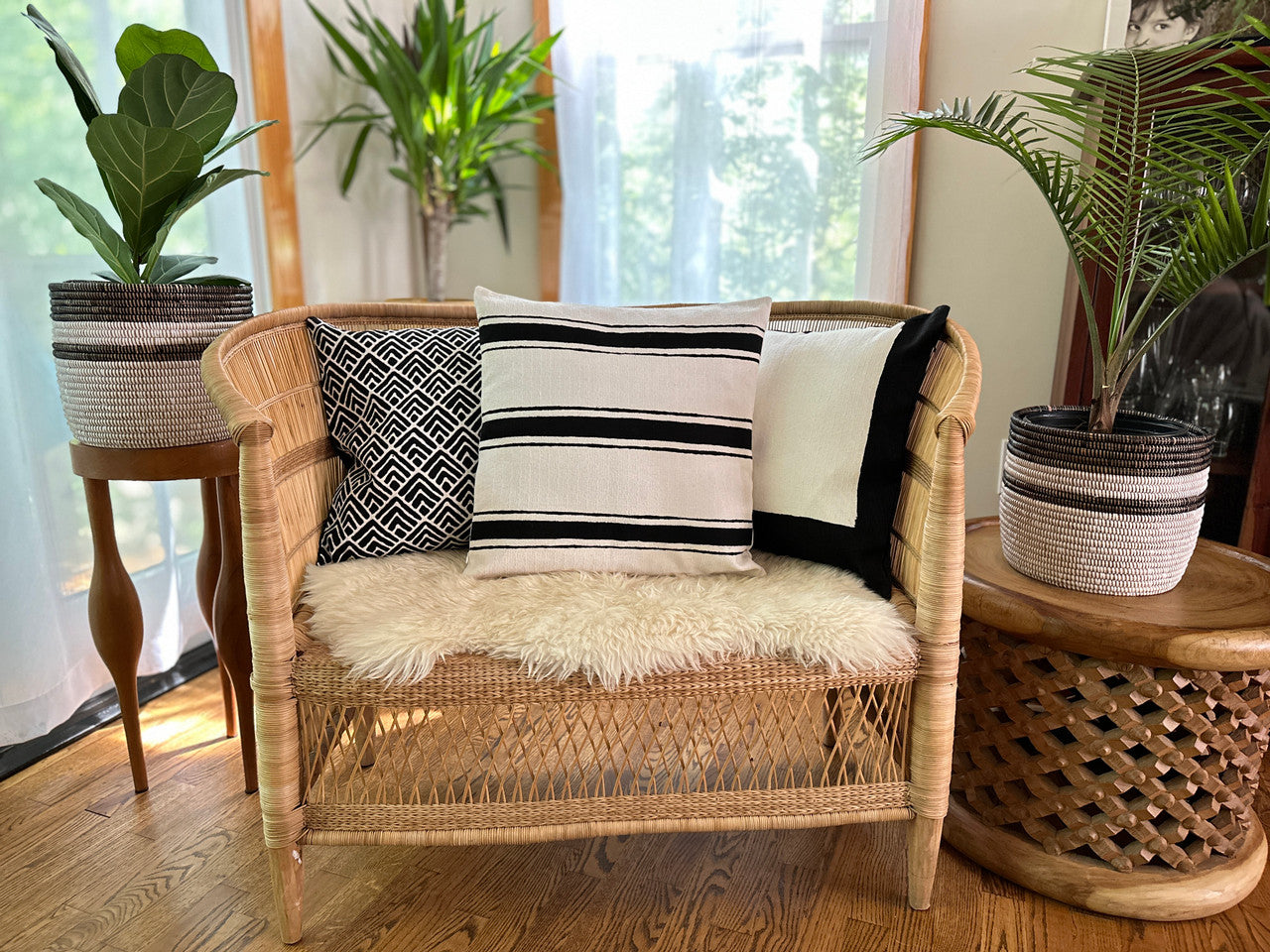 White striped pillow with other ones in living room