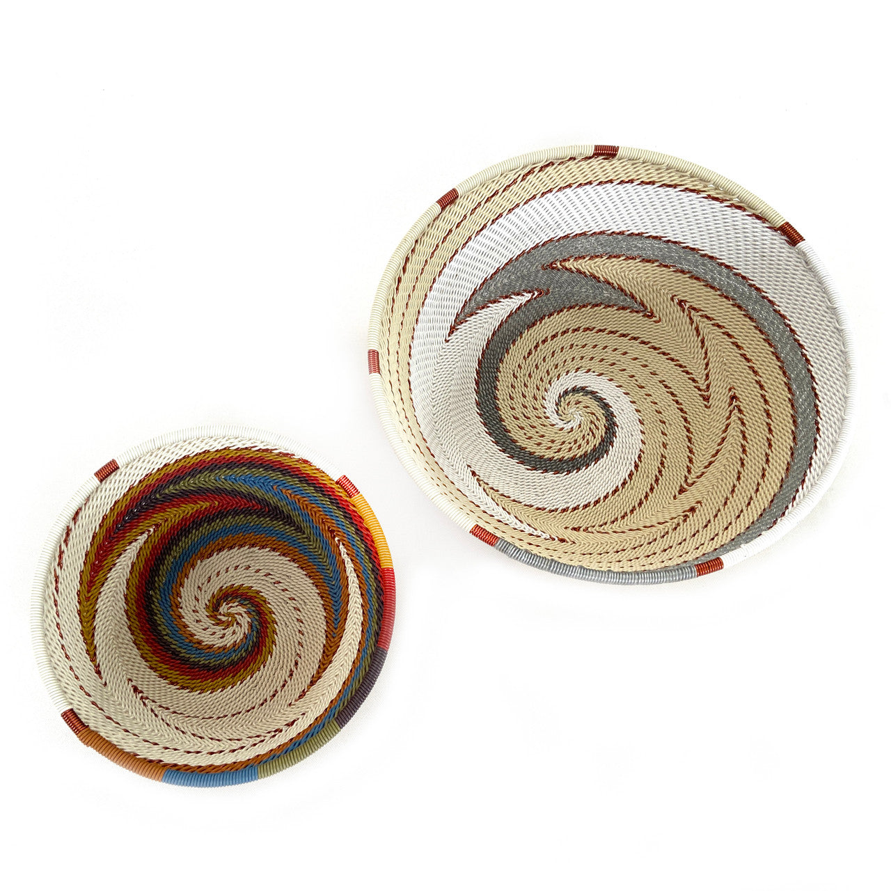 pair of medium and small neutral colored wire baskets