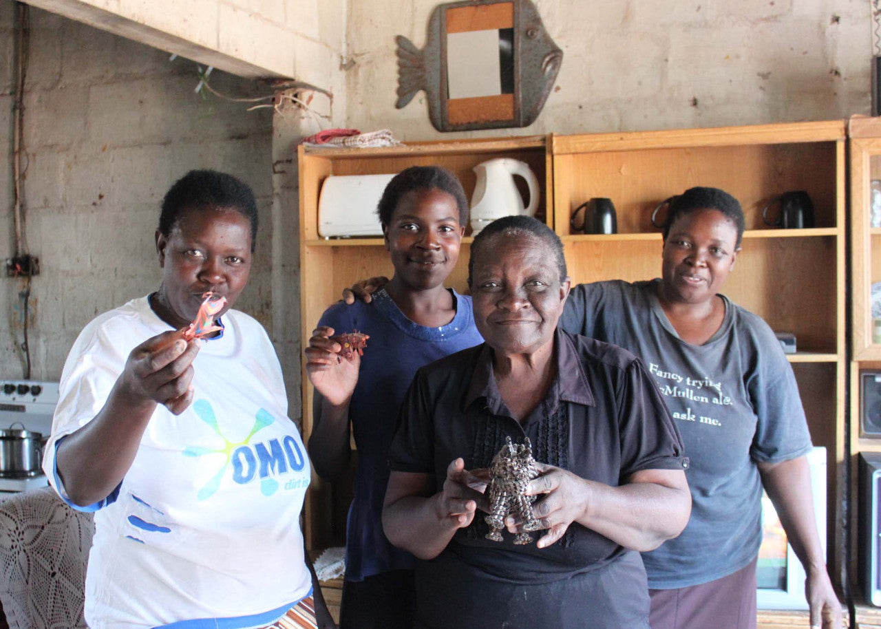 The women of the Thomas family proudly showing their creations