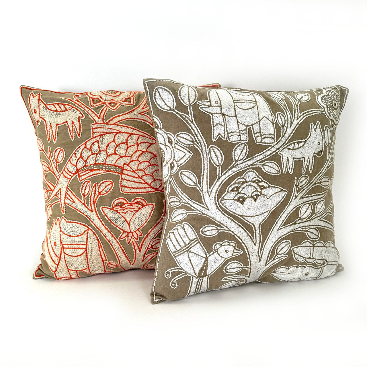 beige pillow with our oranges one.