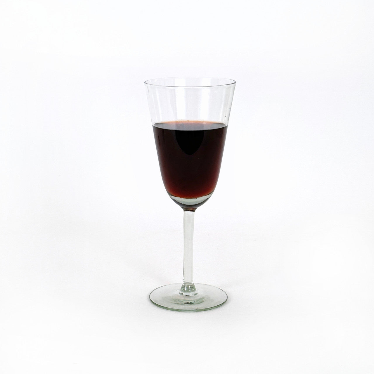 recycled wine glass with wine in it.