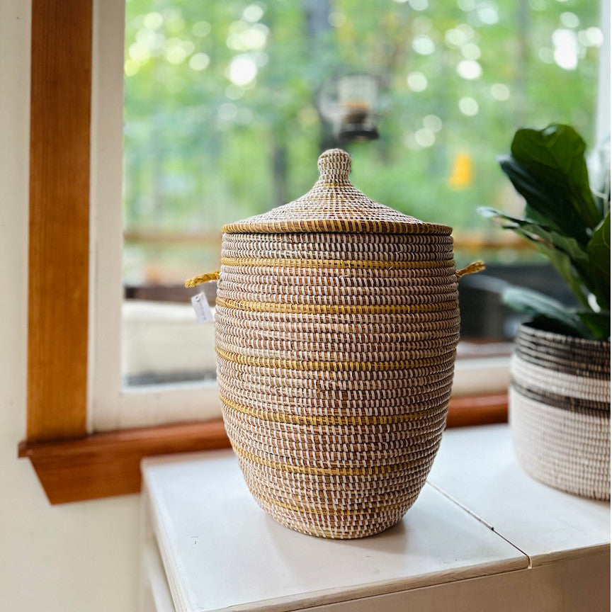 white and natural basket used for storage in the den area