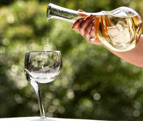 Crooked stem glass with white wine cooler decanter