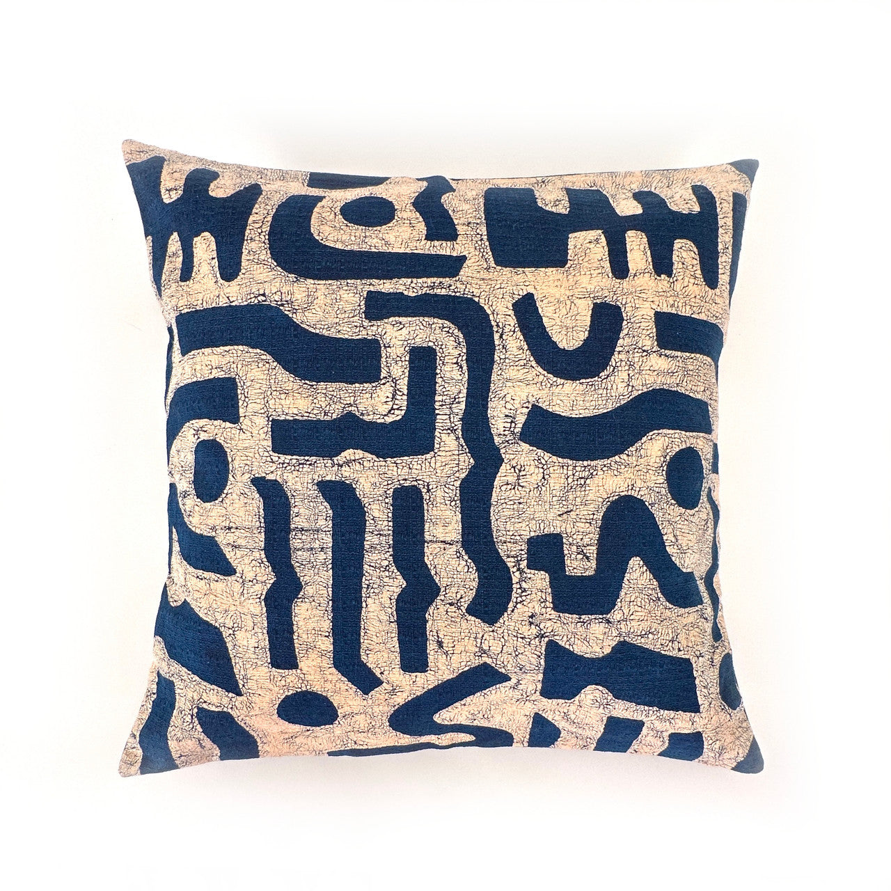 navy and beige pillow with bogo marks design