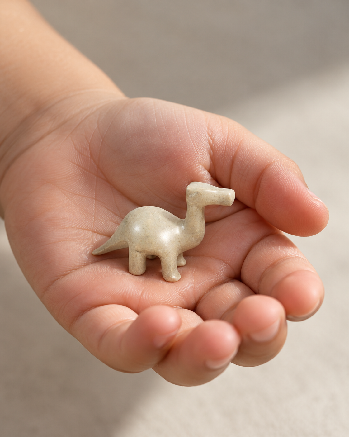 Tiny Hand-Carved Soapstone Dinosaur – Gray, 2"