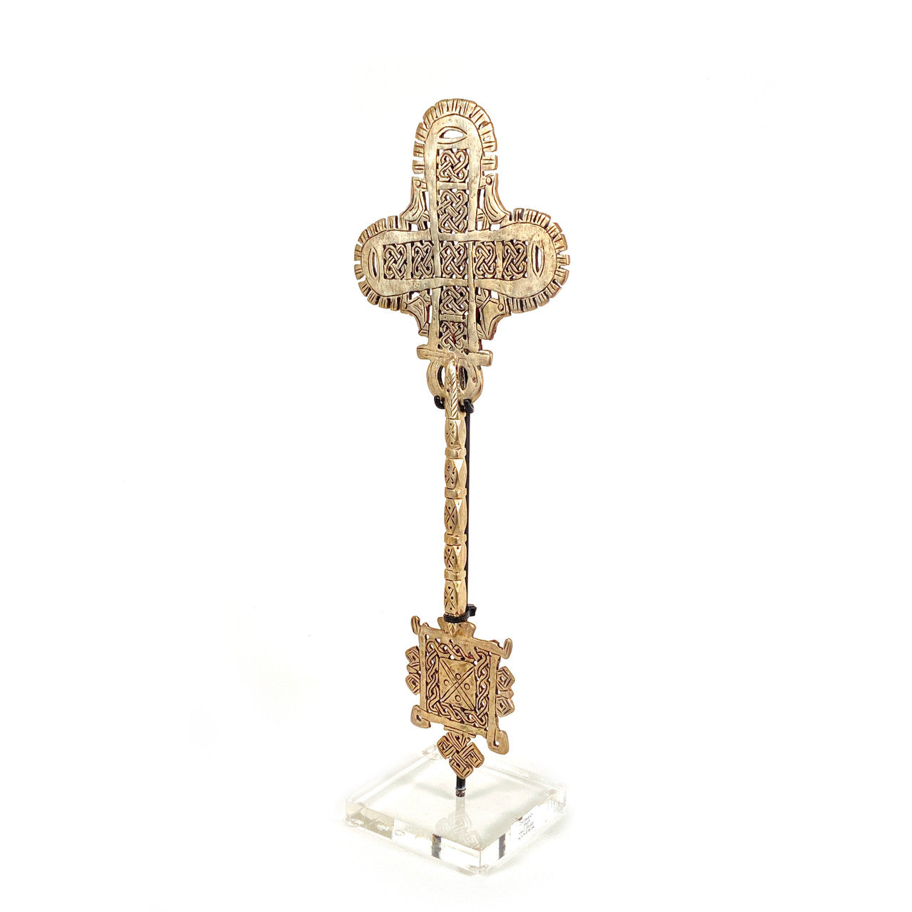 hand held coptic cross on a lucite stand