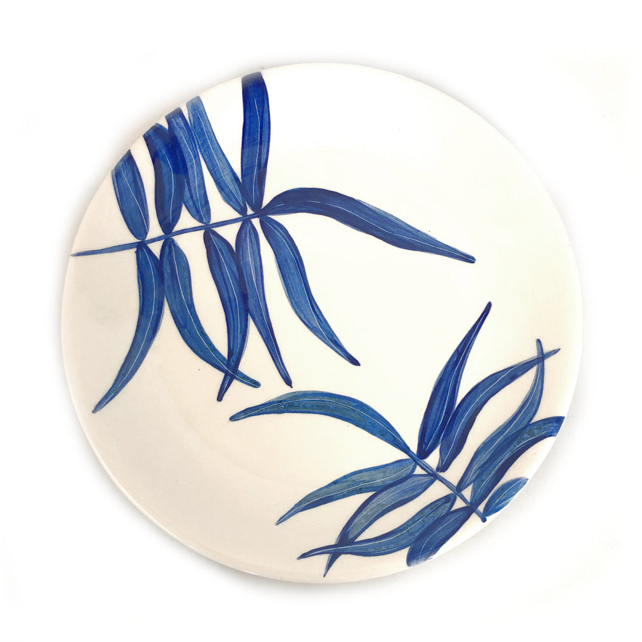 top view of blue floating leaves dinner plate