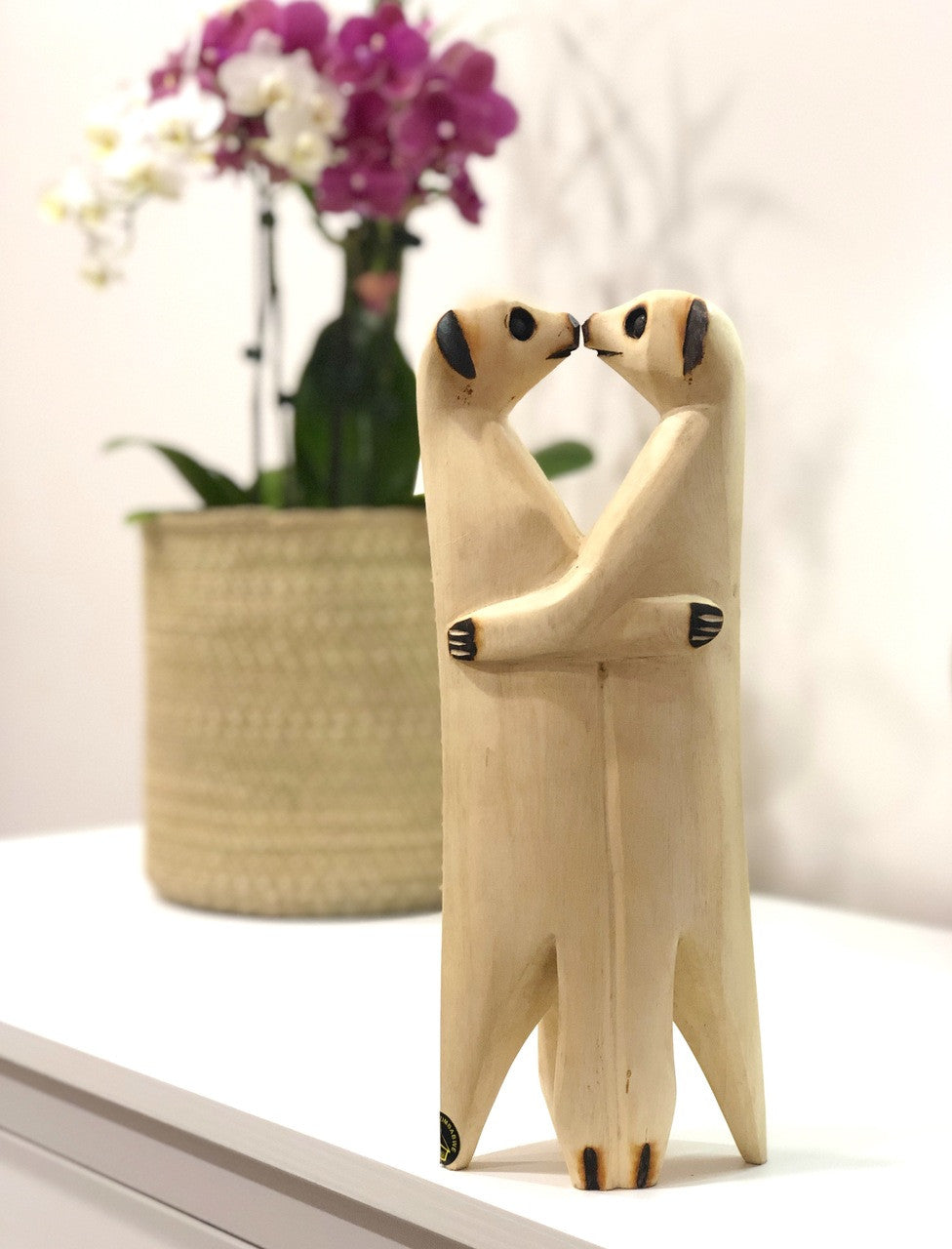 Meerkat lovers on a shelf