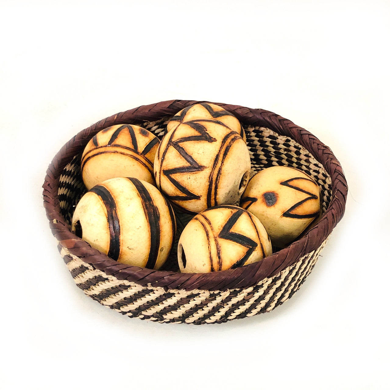 decorative orbs made out of marula gourds