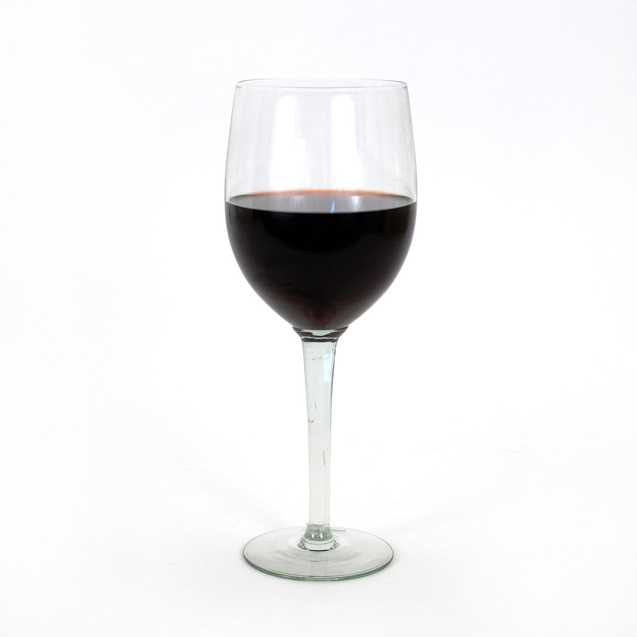 oversized wine glass with half a bottle of wine in it.