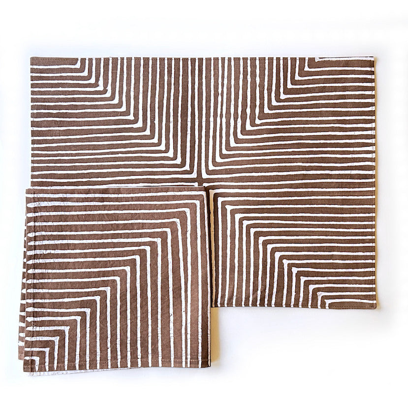 brown linear placemat with matching napkin