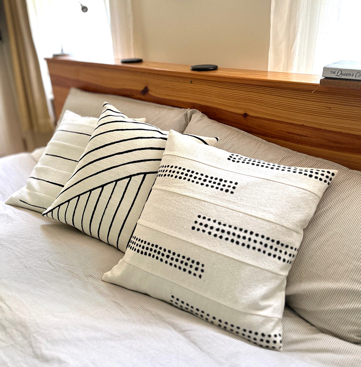 white cotton pillow group on a bed
