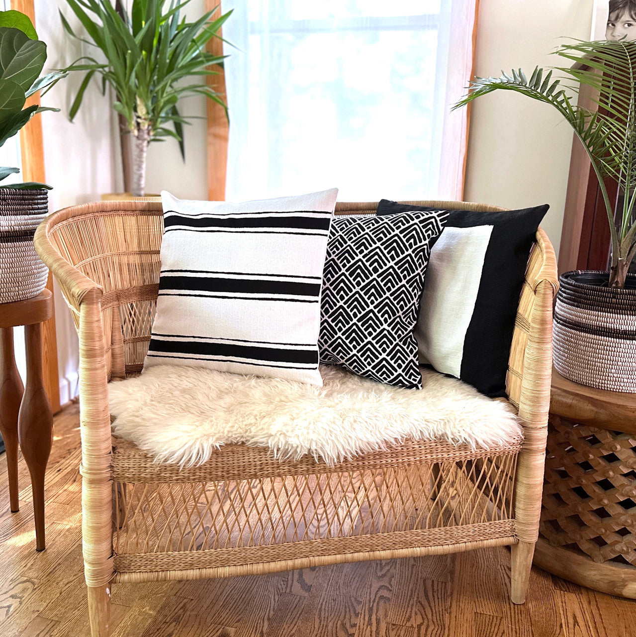 White striped Sadza pillow with other black and white pillows