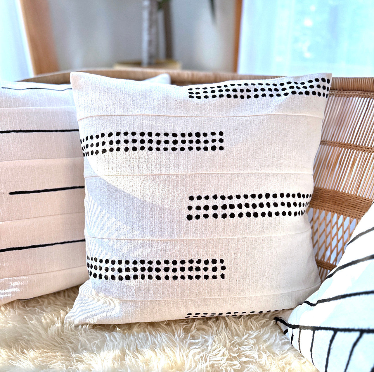 boho dots pillow on white barkweave fabric