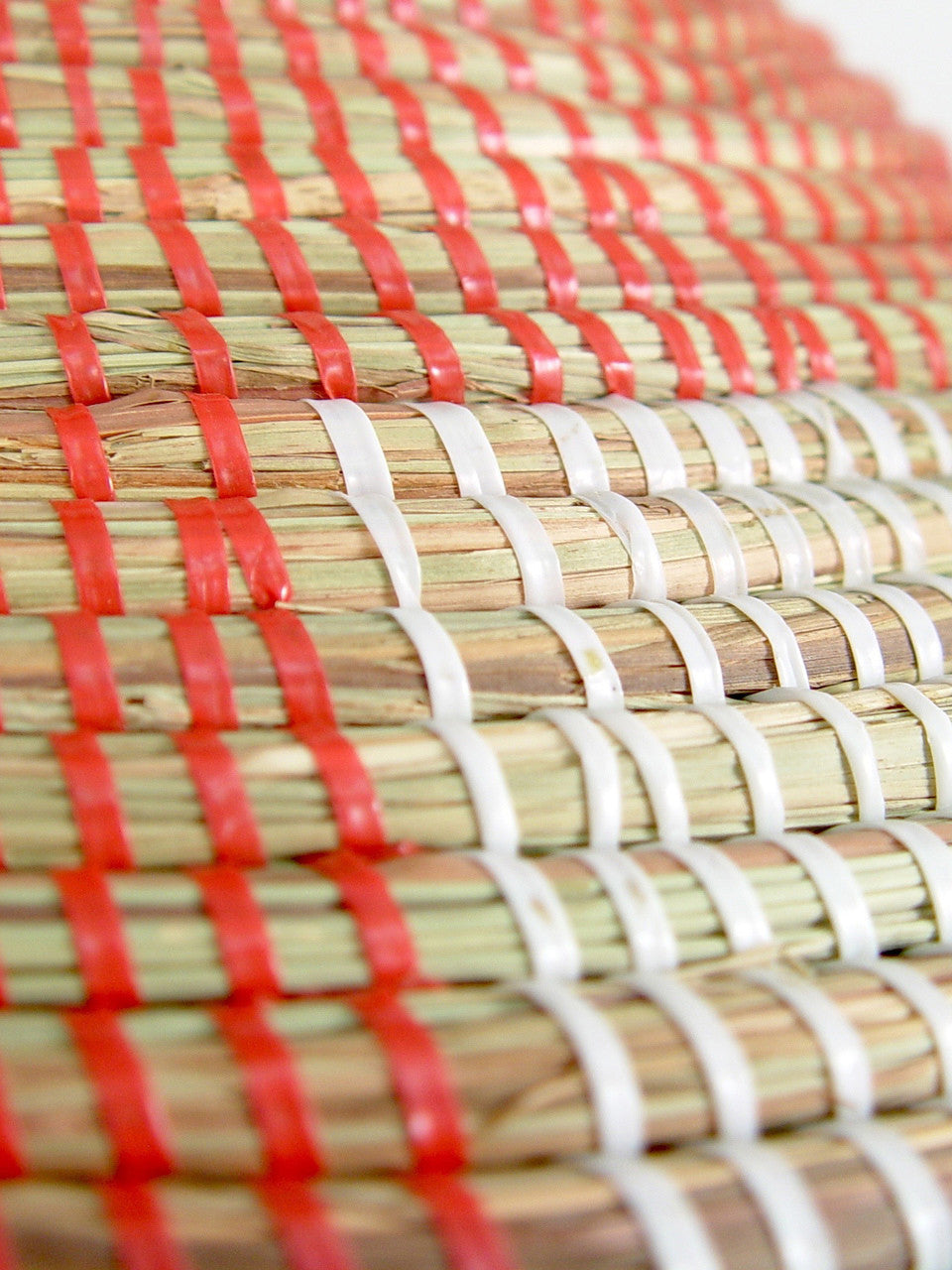 Large red striped basket hamper detail of the weave